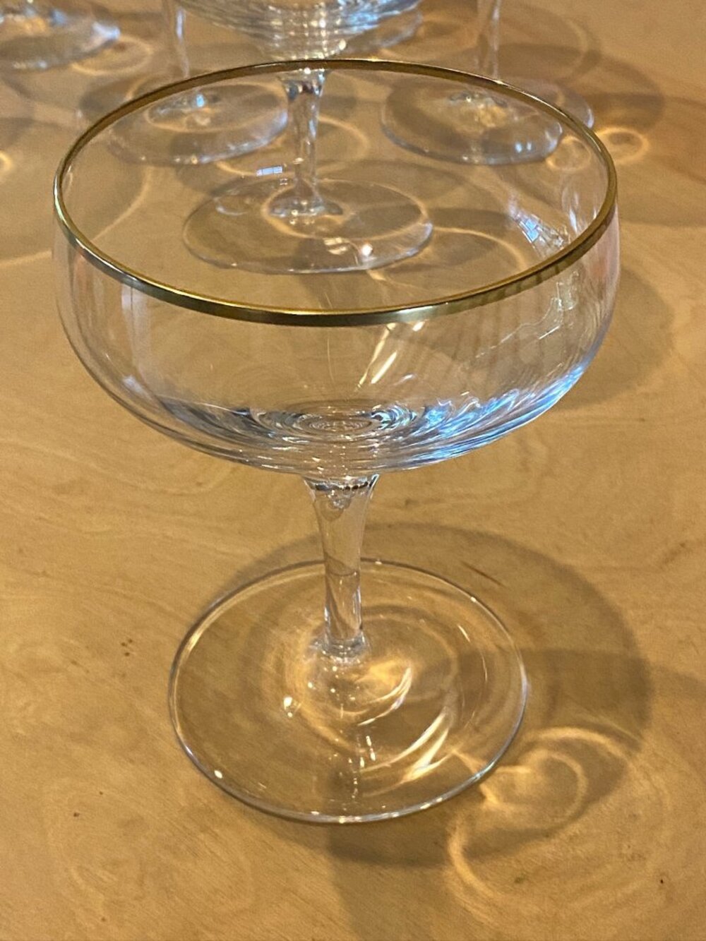 Set of 8 gorgeous vintage crystal champagne/cocktail glasses with gold edges.